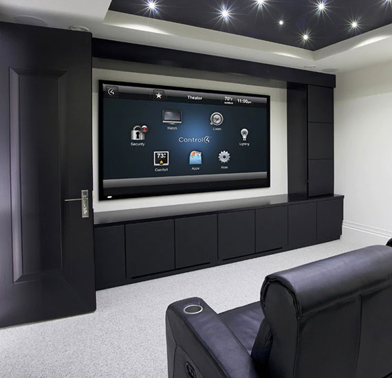 Home theater with smart home services displayed on screen.