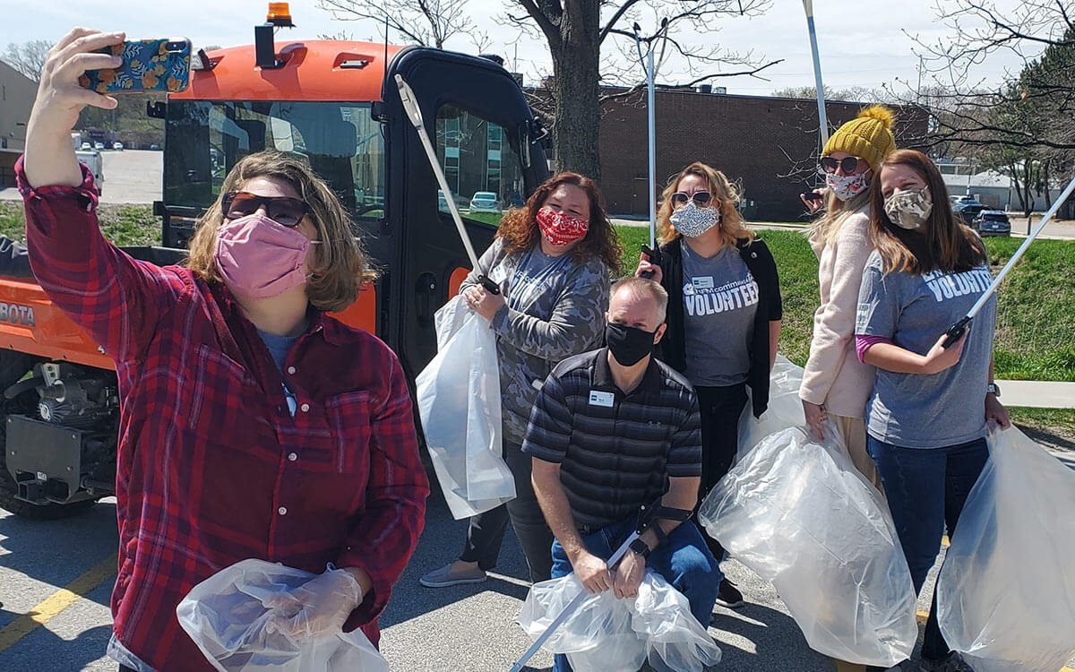 NFM employees volunteering together to help clean up trash and recycle